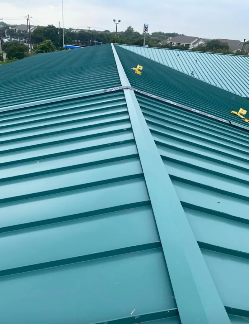 Green commercial metal roof ridge and valley for Metal Roof Repair in Ashton-Sandy Spring